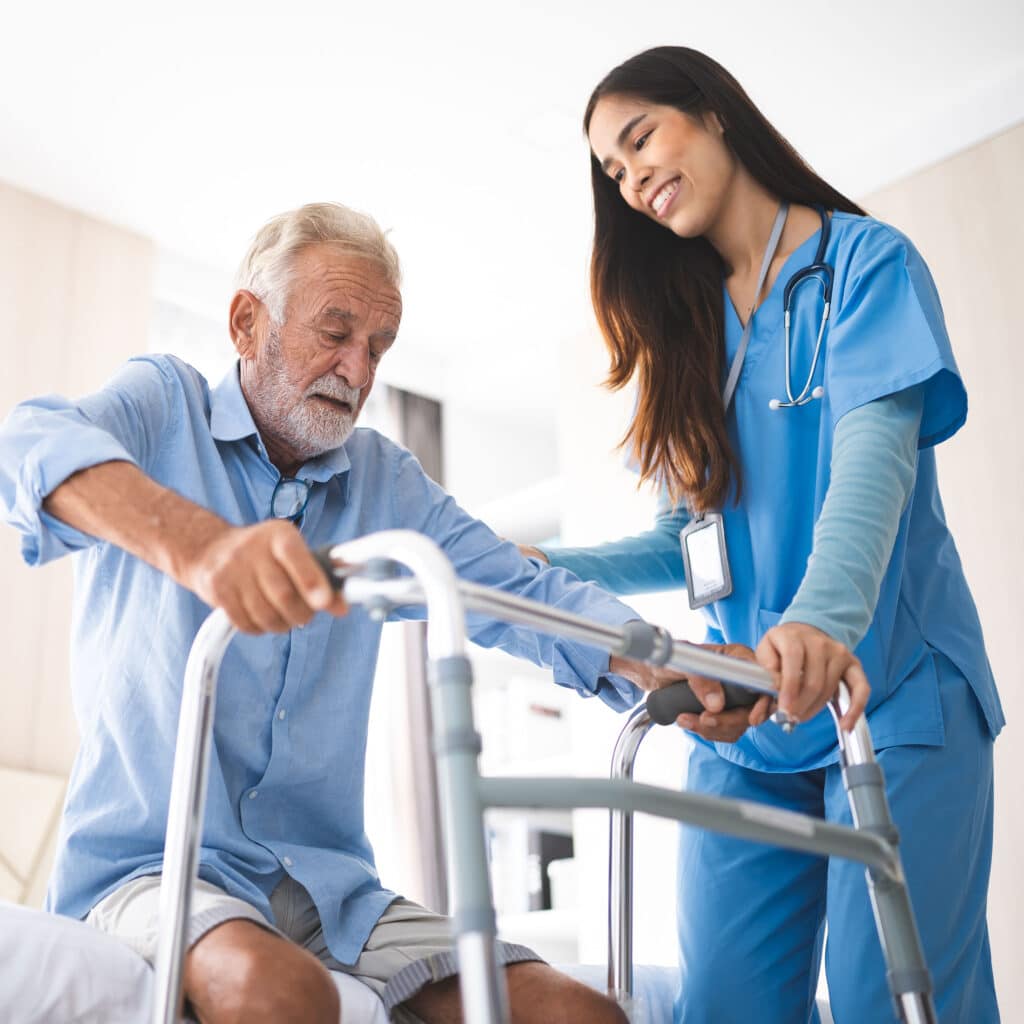 Nurse helping old elderly disable man